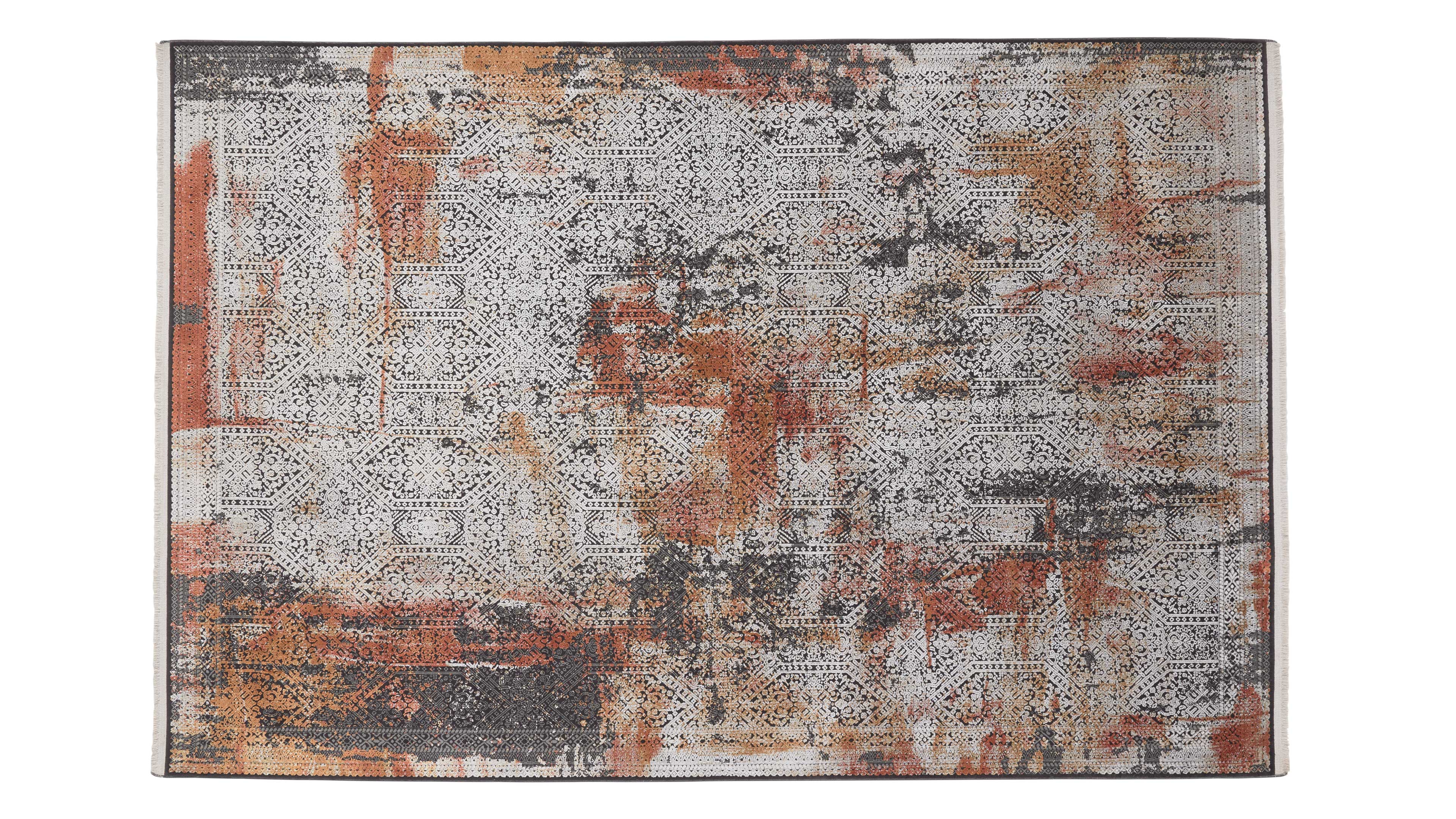 Rechteckiger Teppich mit feinem medaillonartigen Rautenmuster in Hellgrau, überzogen mit rostorange- und anthrazitfarbenen Flecken.
