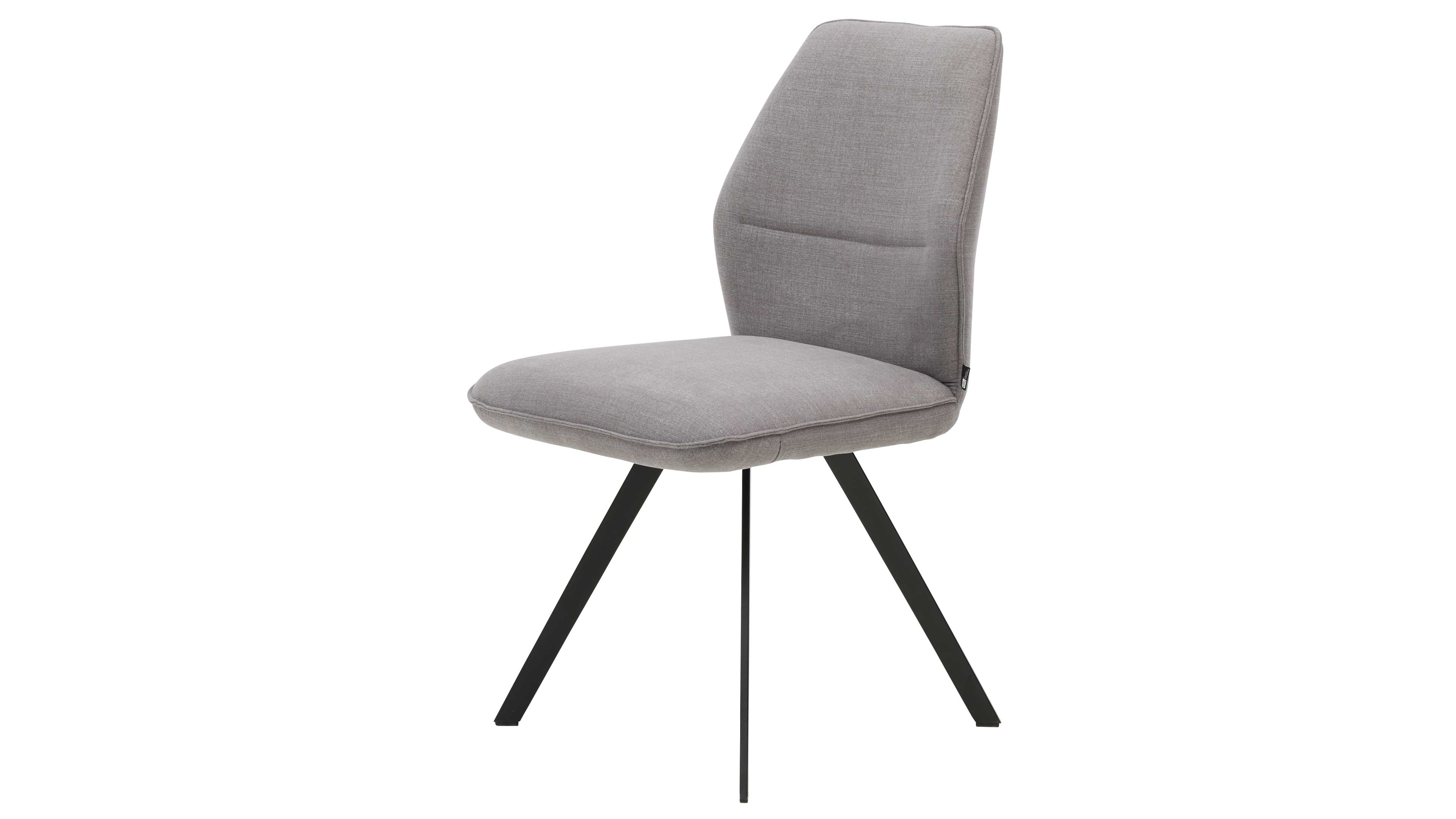 Gepolsterter Esszimmerstuhl mit hellgrauem Bezug, konturierter Rückenlehne und drei schwarzen Metallbeinen, zwei schräg gestellt.