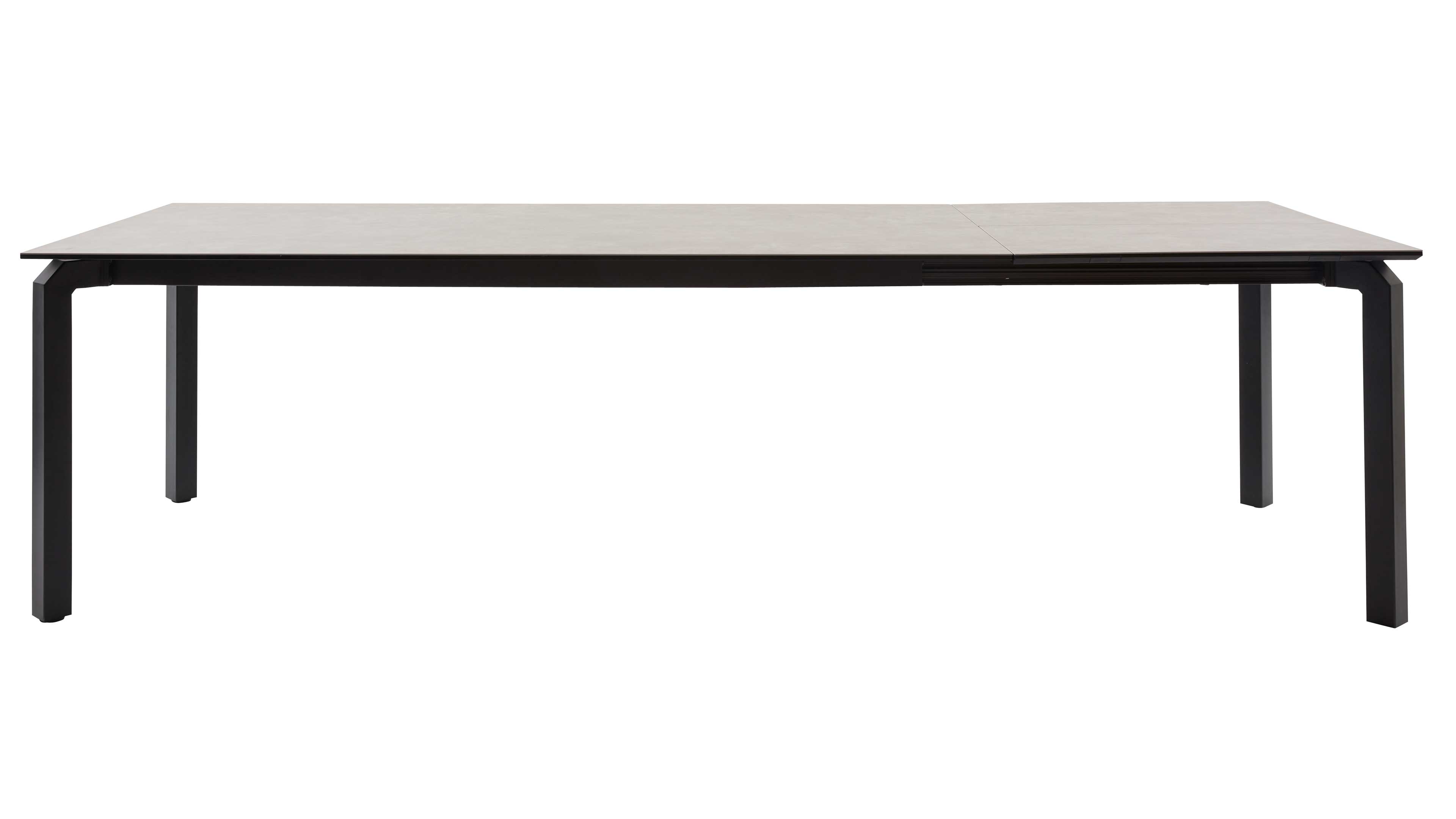 Großer rechteckiger Esstisch mit heller Oberfläche, schwarzer Zarge, sichtbarer Mittelnaht rechts und vier eckigen Metallbeinen.