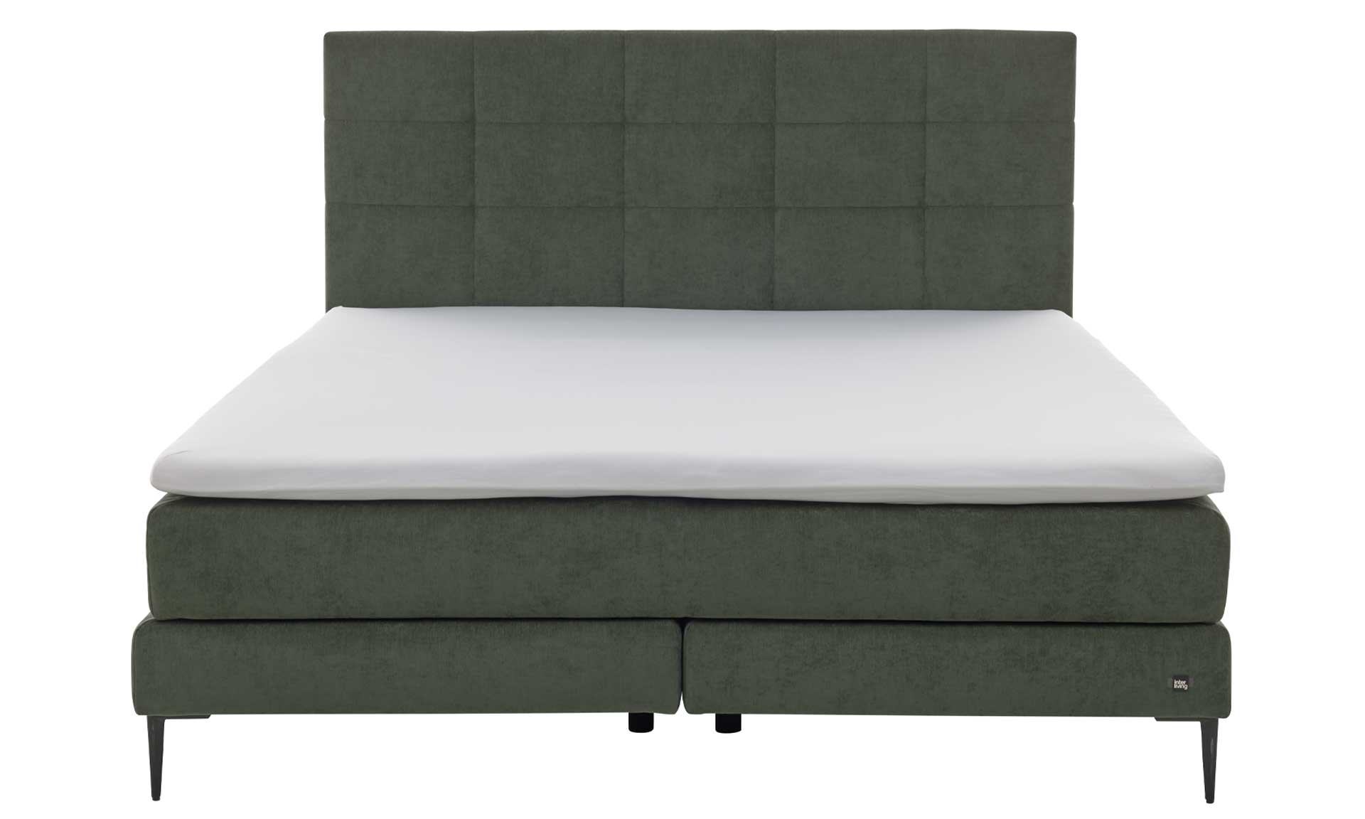 Moosgrünes Boxspringbett mit extra hohem Kopfteil und stoffbezogenen Matratzen